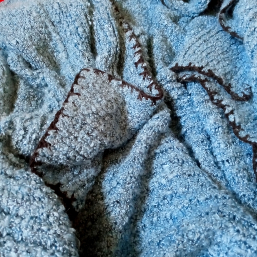 A blue sweater